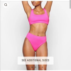 Skims Swim in Taffy Pink